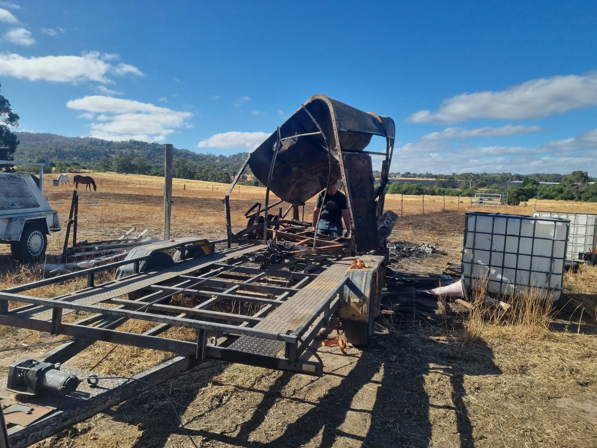 Large metal equipment being loaded for removal