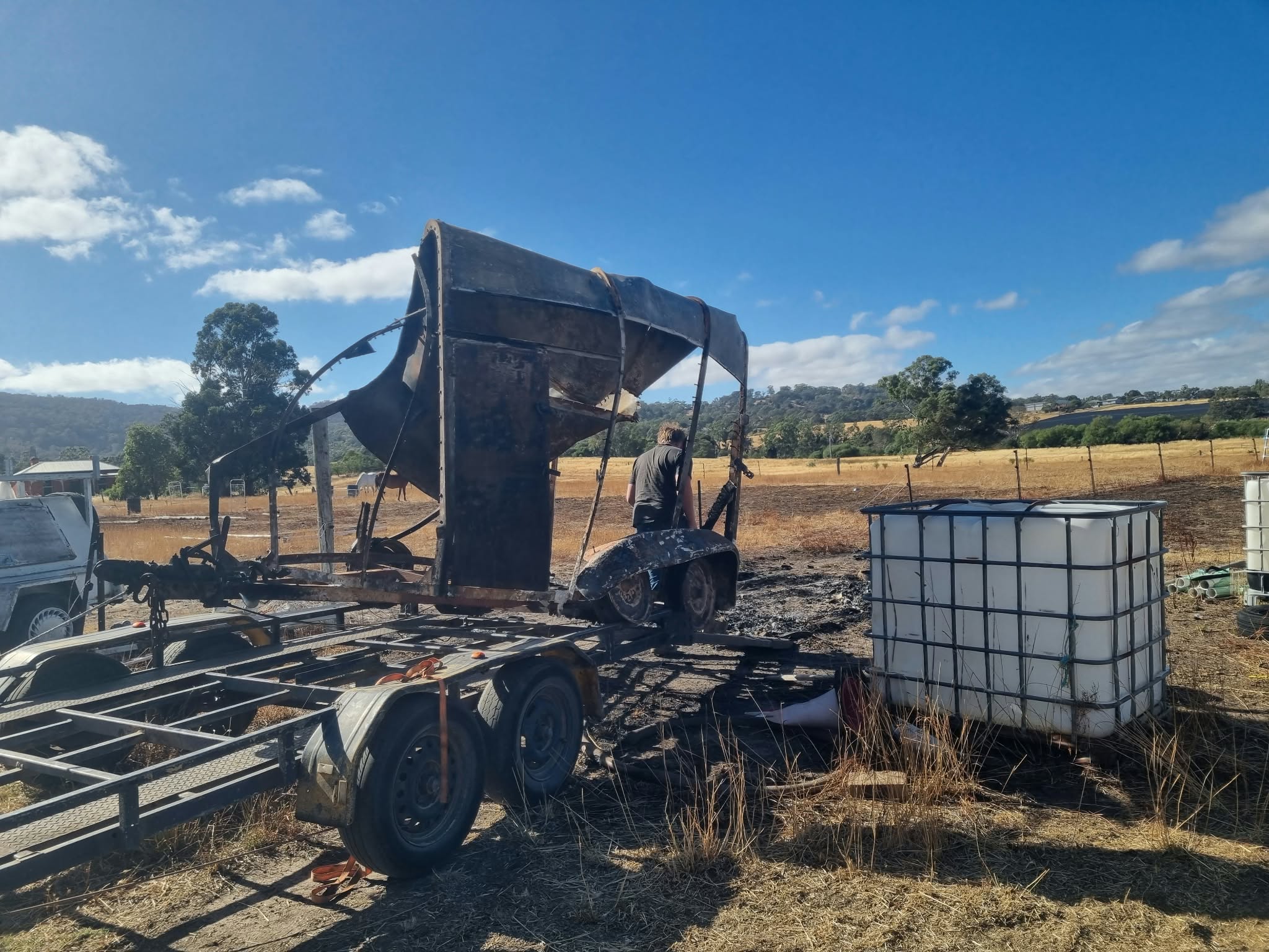 Trailer and metal equipment at a scrap removal job